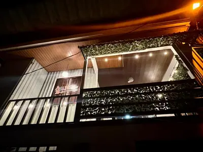 a building with a window with plants on it at Beautiful View House in Tortuguero