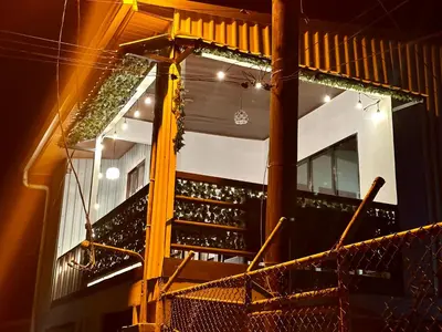 a building with a staircase with plants on it at Beautiful View House in Tortuguero