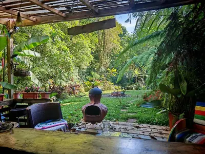 a vase sitting on a table in a garden at Tipi Bribri in Heredia
