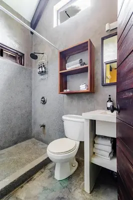 a bathroom with a toilet and a sink and a shower at VIP La Lora Beach Villa best family home in Santa Teresa Beach