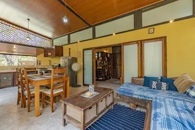 a living room with a couch and a table at Casa Cabo Blanco Mal Pais in Carmen