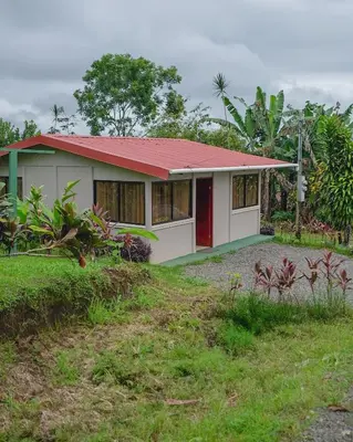 a small house with a red roof at Casa Paraíso - La Fortuna in Fortuna