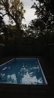 a swimming pool with a view of the sky at Nani House in Montezuma