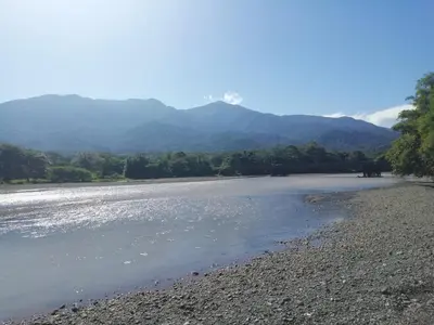 a view of a river with mountains in the background at Casa BAMBÚ, enjoy nature in San Juan de Mata