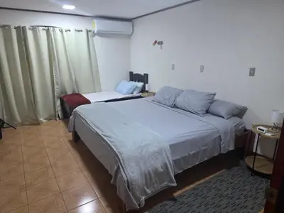a bedroom with two beds in a room at Casa Naboo in Santa Cruz