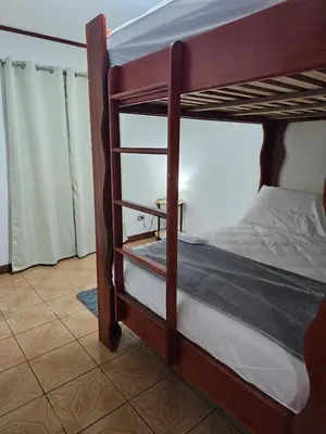 a bedroom with two bunk beds in a room at Casa Naboo in Santa Cruz