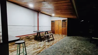 a room with two tables and two stools at Grand Luna - Monteverde in Tilarán
