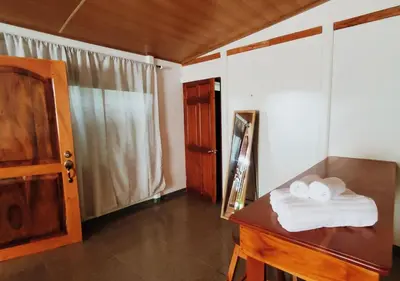 a room with a wooden table with towels on it at Grand Luna - Monteverde in Tilarán