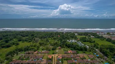 an aerial view of a residential area next to the ocean at Villa Encantada by Vacation Pura Vida in Esterillos
