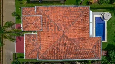 an overhead view of a house with a red roof at Villa Jardin by Vacation Pura Vida in Esterillos