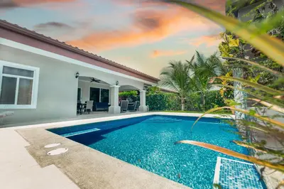 a swimming pool in front of a house at Casa 40 Villa Mario by Vacation Pura Vida in Bejuco