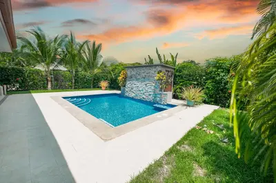 a swimming pool in the backyard of a house at Casa 40 Villa Mario by Vacation Pura Vida in Bejuco