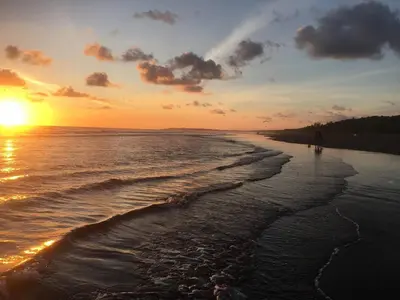 a sunset on a beach with the ocean at Villa Tranquilidad by Vacation Pura Vida in Esterillos