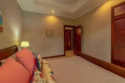 a living room with a couch and a lamp at Villa Estrella de Mar by Vacation Pura Vida in Bejuco