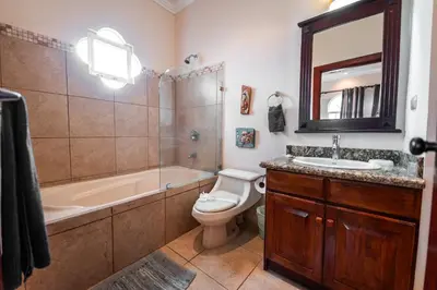 a bathroom with a tub and a toilet and a sink at Villa Zen by Vacation Pura Vida in Esterillos