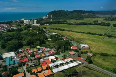 an aerial view of a city with houses and the ocean at Modern 2 Bed 2 Bath l Strong Wifi Carport in Jacó