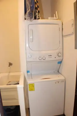 a refrigerator with a microwave on top of it at The Wavefront Beachfront Condo in Bejuco in Bejuco