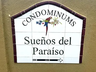a sign on a wall with a bird on it at Spacious 2 Bed 2 Bath l Great Walking Score in Jacó