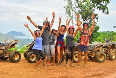 a group of people standing on a dirt road with their hands up at Spacious 2 Bed 2 Bath l Great Walking Score in Jacó