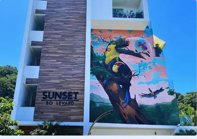 a mural of a bird on the side of a building at Ocean Views l Steps to Beach l Sunset 305 in Jacó