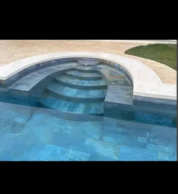 a large pool of blue water in a building at Villa Alegría de vivir by Vacation Pura Vida in Bejuco