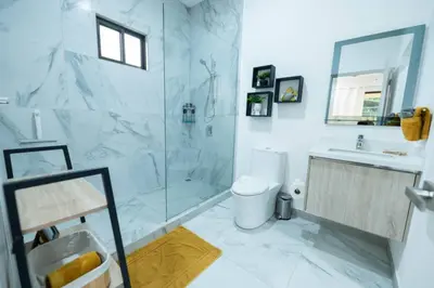 a bathroom with a shower and a toilet and a sink at Villa Alegría de vivir by Vacation Pura Vida in Bejuco