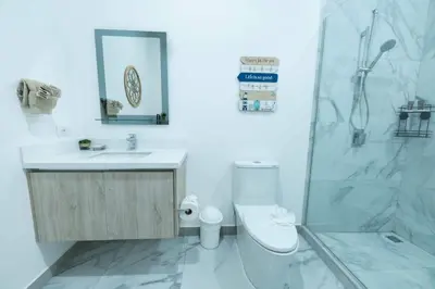 a bathroom with a toilet and a sink and a shower at Villa Alegría de vivir by Vacation Pura Vida in Bejuco