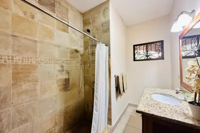a bathroom with a shower and a sink at Villa Camino Corral by Vacation Pura Vida in Esterillos