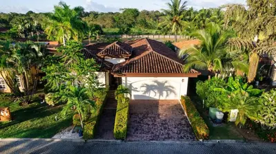 an aerial view of a house with palm trees at Villa Encanto by Vacation Pura Vida in Bejuco