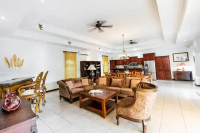 a living room with a couch and a table at Villa Encanto by Vacation Pura Vida in Bejuco