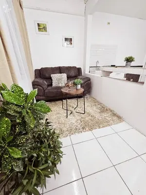 a living room with a couch and a table at Apartamento SamSay II in Cartago