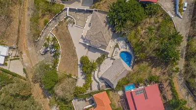 an aerial view of a house with a swimming pool at Villa Pura Vida - All Inclusive in Ocotal