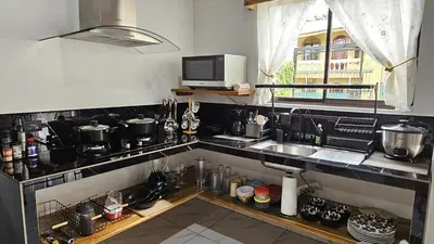 a kitchen with a sink and a counter top at Mi casa, tu casa Manuel Antonio, Quepos in Quepos