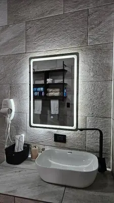 a bath tub in a bathroom with a mirror at Mi casa, tu casa Manuel Antonio, Quepos in Quepos