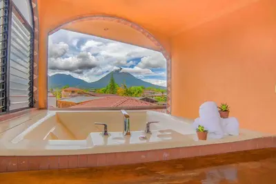 a bathroom with a tub with a large window at FORTUNA FLAT#2, Luxury & Top View in Fortuna