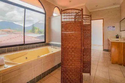 a bathroom with a tub and a large window at FORTUNA FLAT#2, Luxury & Top View in Fortuna
