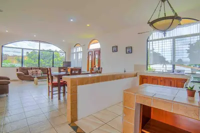 a kitchen and living room with a table and chairs at FORTUNA FLAT#2, Luxury & Top View in Fortuna