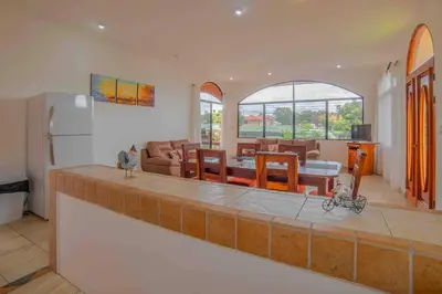 a kitchen and living room with a refrigerator and a table at FORTUNA FLAT#2, Luxury & Top View in Fortuna