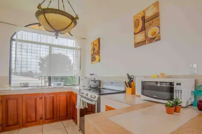 a kitchen with a sink and a stove and a window at FORTUNA FLAT#2, Luxury & Top View in Fortuna