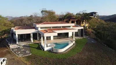 an aerial view of a house with a swimming pool at El Coco Oasis Where Luxury Meets Nature! in Sardinal