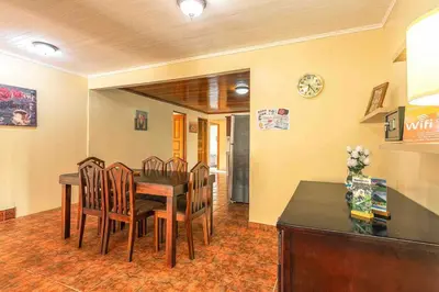 a dining room with a wooden table and chairs at FORTUNA FLAT #1 BEST VALUE & Cozy in Fortuna