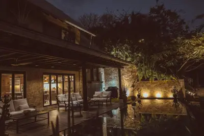 a house with a patio and a pool at night at Casa Azafan - Amazing Sunsets in Garza