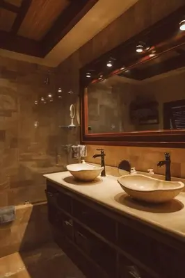 a bathroom with two sinks and a large mirror at Casa Azafan - Amazing Sunsets in Garza