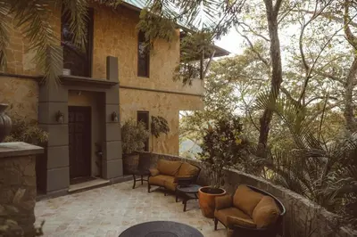 a patio of a house with couches and a table at Casa Azafan - Amazing Sunsets in Garza