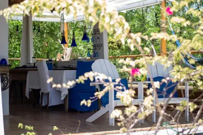 a group of chairs and tables under a tent at Marbella Retreats Casa Azul in Santa Cruz