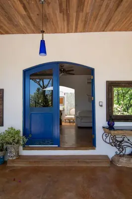a blue door in a room with a living room at Marbella Retreats Casa Azul in Santa Cruz