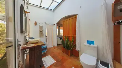 a bathroom with a toilet and a sink at Marbella Retreats Casa Azul in Santa Cruz