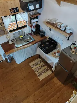 an overhead view of a small kitchen with a sink at Cabaña Lugar de paz in Villa Mills