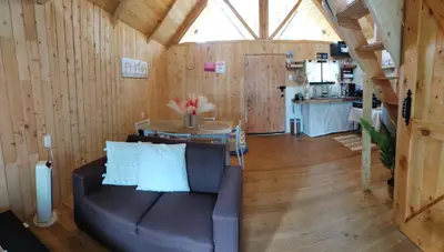 a living room with a couch and a table at Cabaña Lugar de paz in Villa Mills
