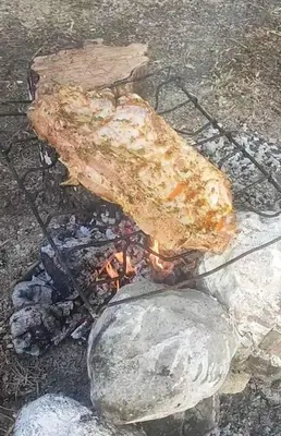 a piece of food sitting on top of a fire at Casa Paraíso in Manzanillo